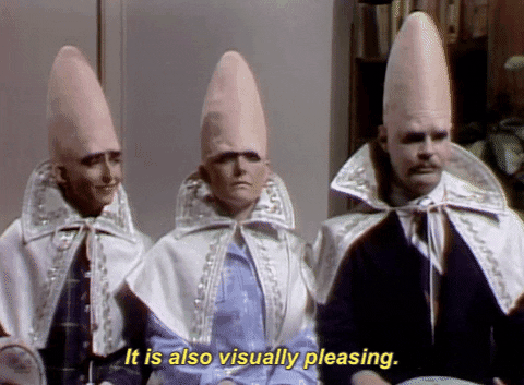 A GIF of three men with odd conical heads saying 'it's also visually pleasing'