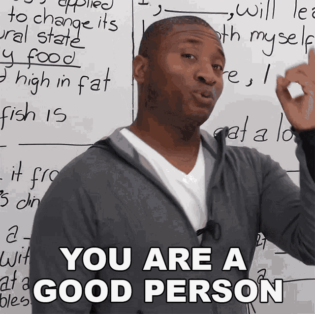 A GIF of a person standing in front of a whiteboard with, looking into the camera and pointing to the viewer, saying 'You are a good person and you want to do what's right.'